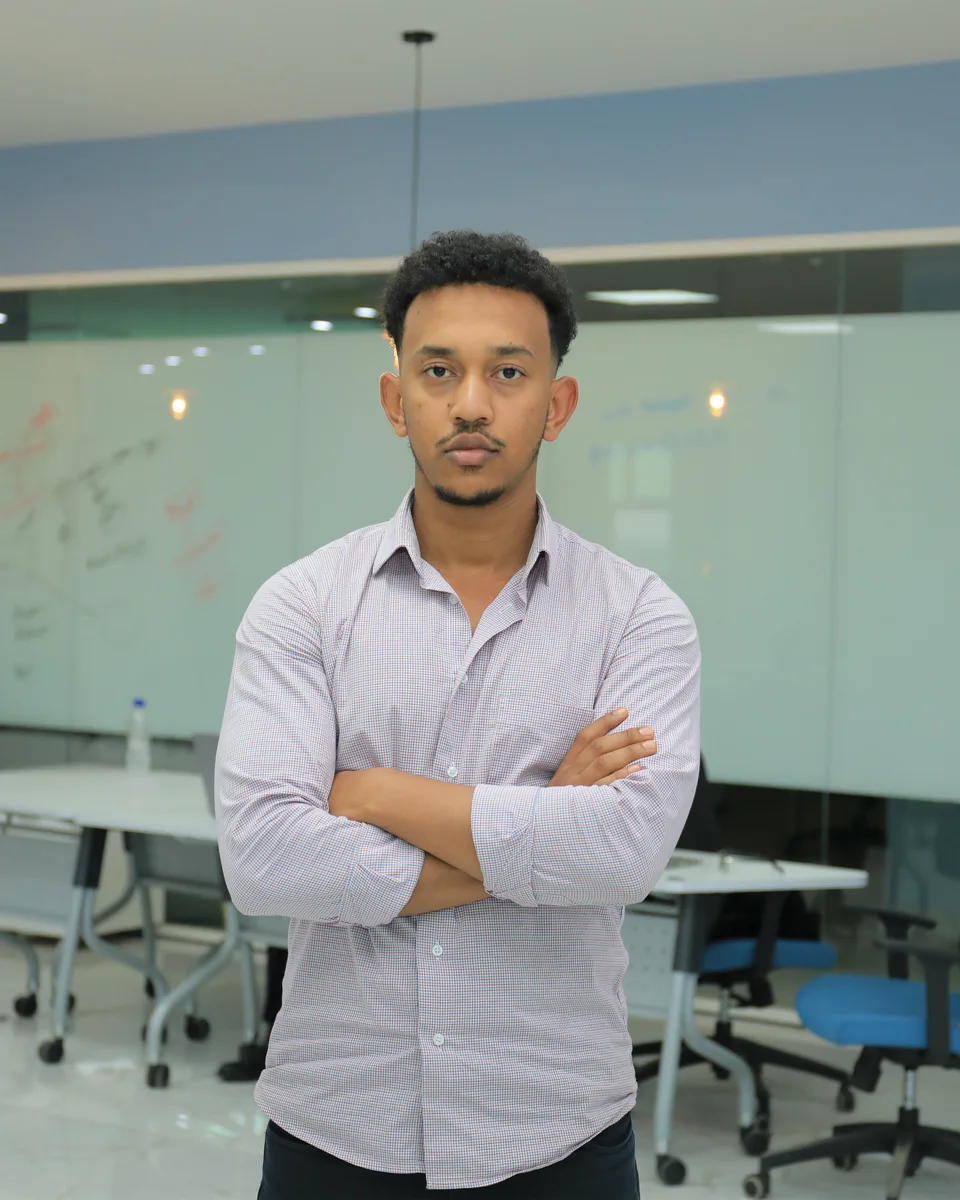 Atnaf Abebe standing in a workspace
